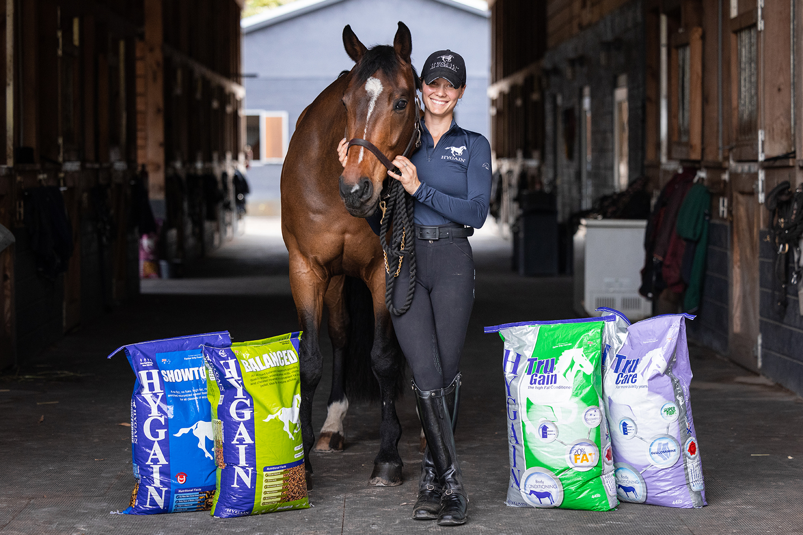 Rider and horse with bags of Hygain feed
